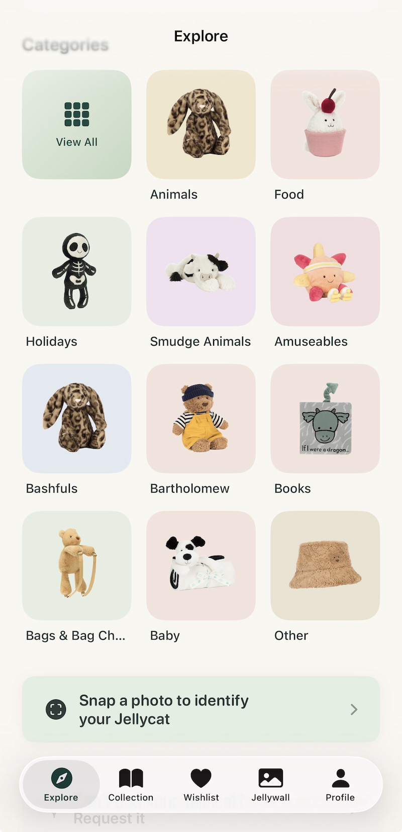 Jellybook app Explore screen showing Jellycat categories — Animals, Food, Holidays, Smudge Animals, Amuseables, Bashfuls, Bartholomew, Books, Bags, Baby and Other — with a 'Snap a photo to identify your Jellycat' shortcut at the bottom.